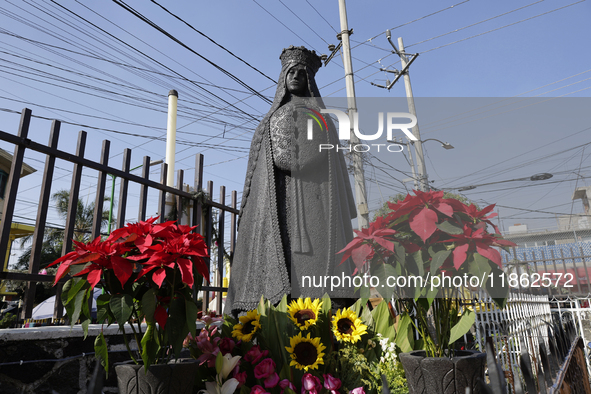 An image of the Virgin of Guadalupe is displayed in Santa Maria Tomatlan in the Iztapalapa municipality, Mexico City, on December 12, 2024,...