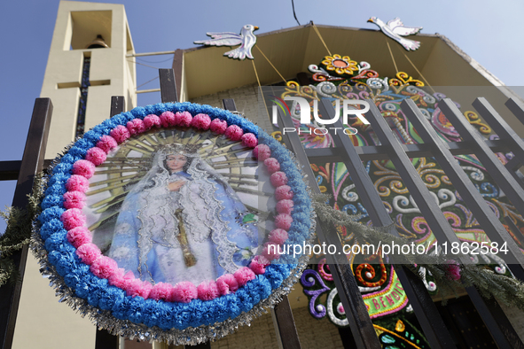 An image of the Virgin of Guadalupe is displayed in Santa Maria Tomatlan in the Iztapalapa municipality, Mexico City, on December 12, 2024,...