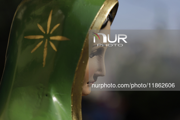 An image of the Virgin of Guadalupe is displayed in Santa Maria Tomatlan in the Iztapalapa municipality, Mexico City, on December 12, 2024,...