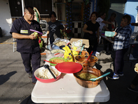 Residents of Santa Maria Tomatlan in the Iztapalapa municipality, Mexico City, live together during the celebration of the Day of the Virgin...