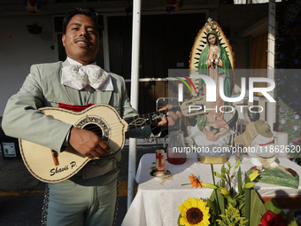 A mariachi sings to the Virgin of Guadalupe in Santa Maria Tomatlan in the Iztapalapa borough, Mexico City, on December 12, 2024, during the...