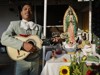 A mariachi sings to the Virgin of Guadalupe in Santa Maria Tomatlan in the Iztapalapa borough, Mexico City, on December 12, 2024, during the...