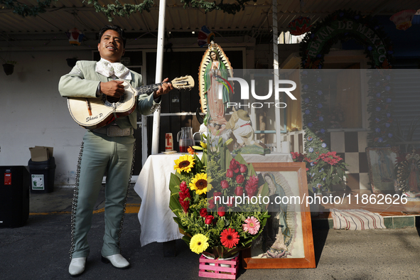 A mariachi sings to the Virgin of Guadalupe in Santa Maria Tomatlan in the Iztapalapa borough, Mexico City, on December 12, 2024, during the...