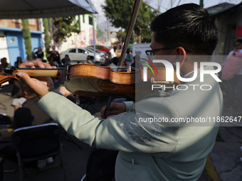 A mariachi sings to the Virgin of Guadalupe in Santa Maria Tomatlan in the Iztapalapa borough, Mexico City, on December 12, 2024, during the...