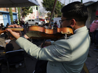 A mariachi sings to the Virgin of Guadalupe in Santa Maria Tomatlan in the Iztapalapa borough, Mexico City, on December 12, 2024, during the...