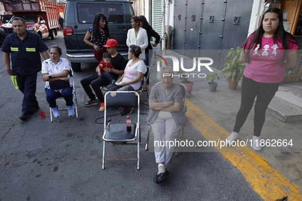 Residents of Santa Maria Tomatlan in the Iztapalapa municipality, Mexico City, live together during the celebration of the Day of the Virgin...