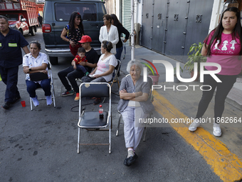 Residents of Santa Maria Tomatlan in the Iztapalapa municipality, Mexico City, live together during the celebration of the Day of the Virgin...