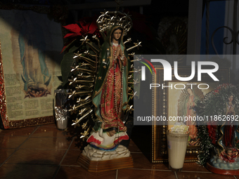 An image of the Virgin of Guadalupe is displayed in Santa Maria Tomatlan in the Iztapalapa municipality, Mexico City, on December 12, 2024,...