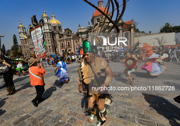 A dancer participates in the pre-Hispanic dance during the celebrations of the Day of the Virgin of Guadalupe in Mexico City, Mexico, on Dec...