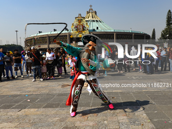 A person dressed in a regional costume takes part in a dance during the celebrations of the Day of the Virgin of Guadalupe in Mexico City, M...