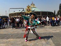 A person dressed in a regional costume takes part in a dance during the celebrations of the Day of the Virgin of Guadalupe in Mexico City, M...