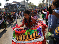 A woman dressed in a folkloric dress takes part in a dance during the celebrations of the Day of the Virgin of Guadalupe in Mexico City, Mex...