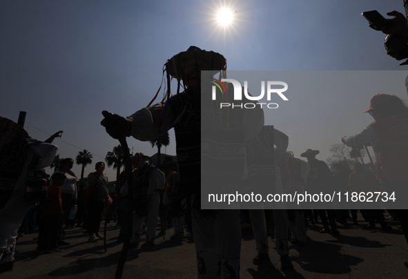 A person dressed in a regional costume takes part in a dance during the celebrations of the Day of the Virgin of Guadalupe in Mexico City, M...