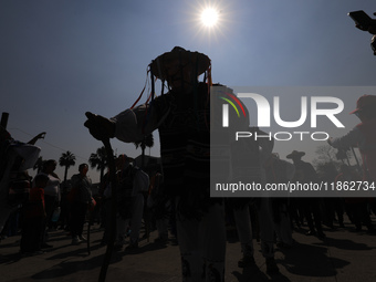 A person dressed in a regional costume takes part in a dance during the celebrations of the Day of the Virgin of Guadalupe in Mexico City, M...