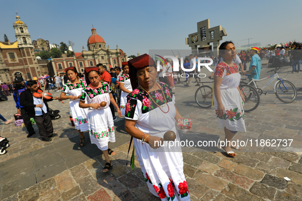 Dancers participate in the pre-Hispanic dance during the celebrations of the Day of the Virgin of Guadalupe in Mexico City, Mexico, on Decem...