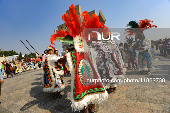 Dancers participate in the pre-Hispanic dance during the celebrations of the Day of the Virgin of Guadalupe in Mexico City, Mexico, on Decem...