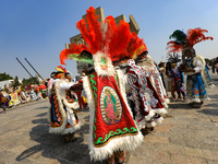 Dancers participate in the pre-Hispanic dance during the celebrations of the Day of the Virgin of Guadalupe in Mexico City, Mexico, on Decem...