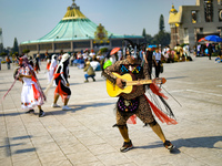 A person dressed in a folk costume takes part in a dance during the celebrations of the Day of the Virgin of Guadalupe in Mexico City, Mexic...