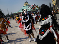 A person dressed in a folk costume takes part in a dance during the celebrations of the Day of the Virgin of Guadalupe in Mexico City, Mexic...