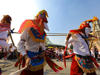 People dressed in folk costumes take part in a dance during the celebrations of the Day of the Virgin of Guadalupe in Mexico City, Mexico, o...