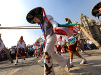 People dressed in folk costumes take part in a dance during the celebrations of the Day of the Virgin of Guadalupe in Mexico City, Mexico, o...