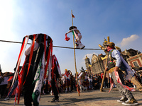 People dressed in folk costumes take part in a dance during the celebrations of the Day of the Virgin of Guadalupe in Mexico City, Mexico, o...