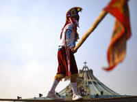 A person dressed in a folk costume takes part in a dance during the celebrations of the Day of the Virgin of Guadalupe in Mexico City, Mexic...