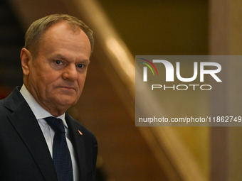 WARSAW, POLAND - DECEMBER 12:
Polish PM Donald Tusk heads to welcome French President Emmanuel Macron at the PM's Office in Warsaw, Poland,...