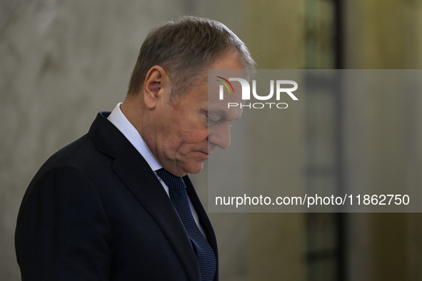 WARSAW, POLAND - DECEMBER 12:
Polish PM Donald Tusk heads to welcome French President Emmanuel Macron at the PM's Office in Warsaw, Poland,...