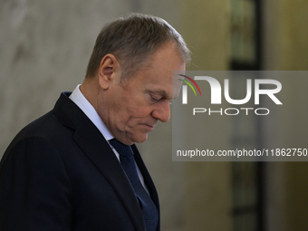 WARSAW, POLAND - DECEMBER 12:
Polish PM Donald Tusk heads to welcome French President Emmanuel Macron at the PM's Office in Warsaw, Poland,...