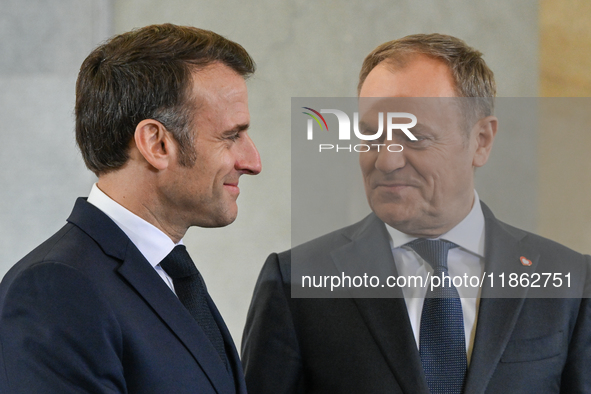 WARSAW, POLAND - DECEMBER 12:
Polish PM Donald Tusk (R) welcomes French President Emmanuel Macron at the PM's Office in Warsaw, Poland, on D...