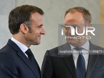 WARSAW, POLAND - DECEMBER 12:
Polish PM Donald Tusk (R) welcomes French President Emmanuel Macron at the PM's Office in Warsaw, Poland, on D...