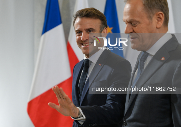 WARSAW, POLAND - DECEMBER 12:
Polish PM Donald Tusk (R) welcomes French President Emmanuel Macron at the PM's Office in Warsaw, Poland, on D...