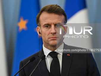 WARSAW, POLAND - DECEMBER 12:
French President Emmanuel Macron delivers remarks during a joint press conference with Polish Prime Minister D...