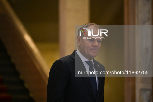 WARSAW, POLAND - DECEMBER 12:
Polish PM Donald Tusk heads to welcome French President Emmanuel Macron at the PM's Office in Warsaw, Poland,...