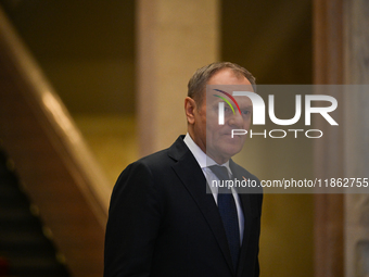 WARSAW, POLAND - DECEMBER 12:
Polish PM Donald Tusk heads to welcome French President Emmanuel Macron at the PM's Office in Warsaw, Poland,...