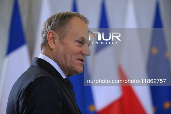 WARSAW, POLAND - DECEMBER 12:
Polish PM Donald Tusk heads to welcome French President Emmanuel Macron at the PM's Office in Warsaw, Poland,...