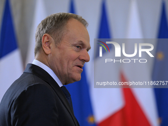 WARSAW, POLAND - DECEMBER 12:
Polish PM Donald Tusk heads to welcome French President Emmanuel Macron at the PM's Office in Warsaw, Poland,...