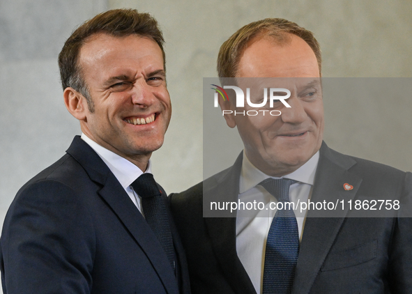 WARSAW, POLAND - DECEMBER 12:
Polish PM Donald Tusk (R) welcomes French President Emmanuel Macron at the PM's Office in Warsaw, Poland, on D...