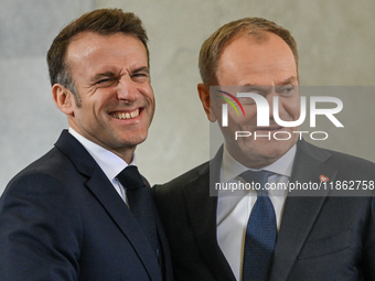 WARSAW, POLAND - DECEMBER 12:
Polish PM Donald Tusk (R) welcomes French President Emmanuel Macron at the PM's Office in Warsaw, Poland, on D...