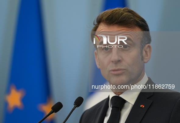 WARSAW, POLAND - DECEMBER 12:
French President Emmanuel Macron delivers remarks during a joint press conference with Polish Prime Minister D...