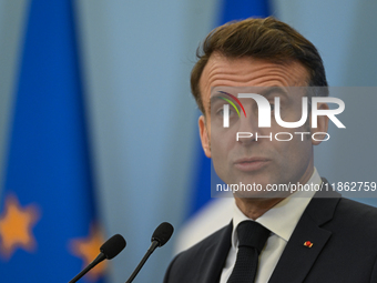 WARSAW, POLAND - DECEMBER 12:
French President Emmanuel Macron delivers remarks during a joint press conference with Polish Prime Minister D...