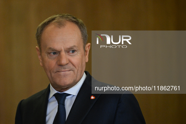 WARSAW, POLAND - DECEMBER 12:
Polish PM Donald Tusk heads to welcome French President Emmanuel Macron at the PM's Office in Warsaw, Poland,...