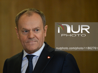 WARSAW, POLAND - DECEMBER 12:
Polish PM Donald Tusk heads to welcome French President Emmanuel Macron at the PM's Office in Warsaw, Poland,...