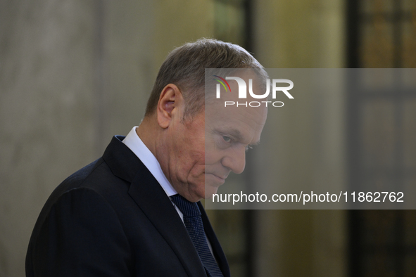 WARSAW, POLAND - DECEMBER 12:
Polish PM Donald Tusk heads to welcome French President Emmanuel Macron at the PM's Office in Warsaw, Poland,...