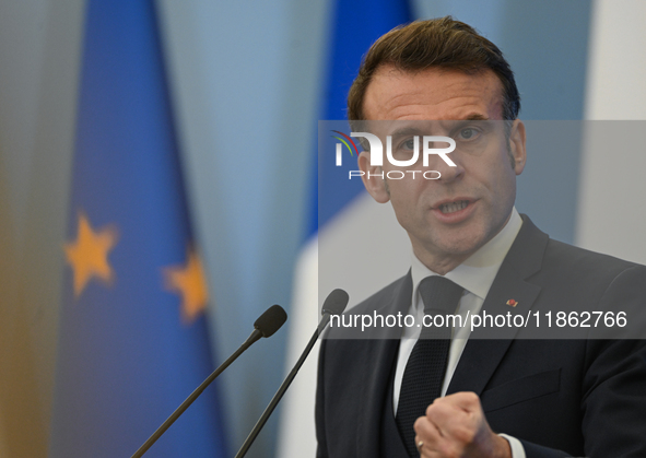 WARSAW, POLAND - DECEMBER 12:
French President Emmanuel Macron delivers remarks during a joint press conference with Polish Prime Minister D...