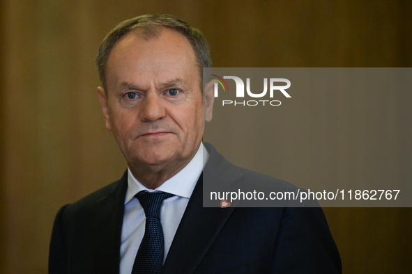 WARSAW, POLAND - DECEMBER 12:
Polish PM Donald Tusk heads to welcome French President Emmanuel Macron at the PM's Office in Warsaw, Poland,...