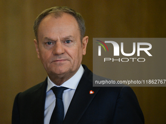 WARSAW, POLAND - DECEMBER 12:
Polish PM Donald Tusk heads to welcome French President Emmanuel Macron at the PM's Office in Warsaw, Poland,...