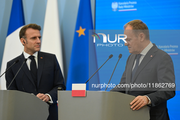 WARSAW, POLAND - DECEMBER 12:
Polish Prime Minister Donald Tusk (R) delivers remarks during a joint press conference with French President E...