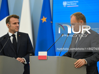 WARSAW, POLAND - DECEMBER 12:
Polish Prime Minister Donald Tusk (R) delivers remarks during a joint press conference with French President E...